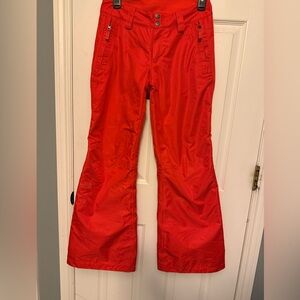 Women’s XS Northface bright orange waterproof snow pants.
